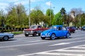 Bucharest, Romania, 24 April 2021 Old retro vivid blue turquoise Volkswagen Beetle classic car in traffic in a street in a sunny Royalty Free Stock Photo