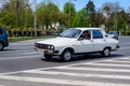 Bucharest, Romania, 24 April 2021 Old retro white Romanian Dacia 1310 classic car in traffic in a street in a sunny spring day