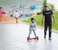 BUCHAREST, ROMANIA, - April 2, 2016: People using hoverboard, a self-balancing two-wheeled board, in the park. Editorial content