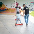 BUCHAREST, ROMANIA, - April 2, 2016: People using hoverboard, a self-balancing two-wheeled board, in the park. Editorial content