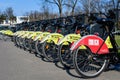 Bucharest, Romania, 3 April 2021: Public bike sharing bicycles from iVelo and Raiffeisen Bank in a docking station, available for Royalty Free Stock Photo