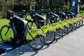 Bucharest, Romania, 3 April 2021: Public bike sharing bicycles from iVelo and Raiffeisen Bank in a docking station, available for Royalty Free Stock Photo