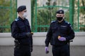 Romanian gendarmes with surgical masks due to the covid-19 pandemic take the Holy Light during the orthodox Easter