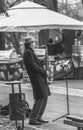 Street musician man playing at saxophone in King Mihai I park ( Herestrau), in Bucharest Royalty Free Stock Photo