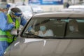 A woman is getting Covid-19 vaccine in his arm in his car, in a drive thru vaccination centre in Bucharest, Romania