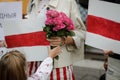 Details with a little girl holding flowers during a political rally supporting the protests in Belarus