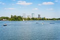 Many people in boats paddling on the lake in King Mihai I park (Herestrau). Couple on a
