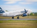 A TAROM BOEING 737-700 airplane flying against clear blue sky. Airplane takes off from Henry Royalty Free Stock Photo