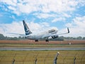 A TAROM BOEING 737-700 airplane flying against clear blue sky. Airplane takes off from Henry Royalty Free Stock Photo