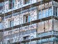 Building covered with scaffolding. Reconditioning process of an apartment building in Bucharest