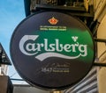 Bucharest/Romania - 05.30.2020: Carlsberg logo outdoor sign in Bucharest, Carlsberg is a Danish multinational brewer