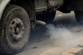 Details with the exhaust pipe of an old truck producing heavy smoke Royalty Free Stock Photo