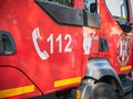 112 emergency number on a fire fighter car Royalty Free Stock Photo