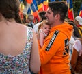 Bucharest/Romania - 09.19.2020: Father with his newborn child in his hands posing at the protest against wearing face masks in