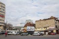 decaying buildings in an old and ruined district of downtown Bucharest, being soon redeveloped, with a business skyscraper