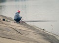Bucharest/Romania - 11.19.2020: Fisherman on the edge Dambovita Lake Lacul Morii in Bucharest, Romania
