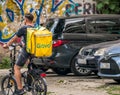 Bucharest/Romania - 07.25.2020: Glovo courier on a bicycle delivering the order