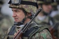 Details with a Romanian army soldier holding an AK 47 assault rifle during a military ceremony at the Monument of the Unknown