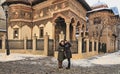 Bucharest, Romania - January 8, 2019: Two tourists take a selfie on the background of the  Stavropol Monastery in the name of Mch Royalty Free Stock Photo