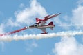Bucharest, Romania - July 28, 2018: Military jet fighter airplane with smoke trails performing at airshow. Turkish Stars aerobatic