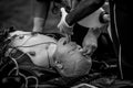 Paramedics perform CPR to a plastic dummy during a public demonstration on how to save a victim Royalty Free Stock Photo