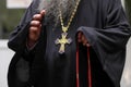 Details with the prayer robe and golden cross of a high ranking Romanian priest archimandrite Royalty Free Stock Photo