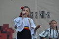 International Folklore Festival: Romanian girl singer in traditional costume