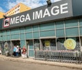 Bucharest/Romania - 06.22.2020: Logo of the Mega Image supermarket at the entrance of the store in Bucharest. Mega image is a part Royalty Free Stock Photo