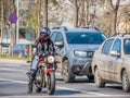 Female biker on a motorcycle in traffic at the stoplight