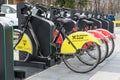 Bucharest, Romania, 16 March 2019: Public bike sharing bicycles from iVelo and Raiffeisen Bank in a docking station, available for Royalty Free Stock Photo