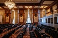 BUCHAREST, ROMANIA - MARCH 13, 2023: Selective blur on empty chairs in a conference hall with opulent design in the interior of