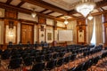 BUCHAREST, ROMANIA - MARCH 13, 2023: Selective blur on empty chairs in a conference hall with opulent design in the interior of
