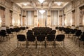 BUCHAREST, ROMANIA - MARCH 13, 2023: Selective blur on empty chairs in a conference hall with opulent design in the interior of