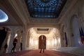 BUCHAREST, ROMANIA - MARCH 13, 2023: Selective blur on tourist taking pictures in a the opulent design of a hall in interior of