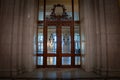 BUCHAREST, ROMANIA - MARCH 13, 2023: Selective blur on wooden & glass doors and opulent design of the interior of the Romanian