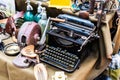 Stall with old items for sale, typewriter, soda bottles and other things Royalty Free Stock Photo