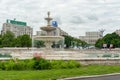 BUCHAREST, ROMANIA - MAY 30, 2017: Bucharest Cityscape with Street Fountain and Empty Street. Parliament in Background