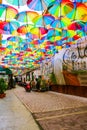 Bucharest, Romania, May 17, 2019: Cafe with colorful umbrellas on a street in Bucharest. Royalty Free Stock Photo