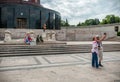 BUCHAREST, ROMANIA - MAY 14, 2017: Carol Park in Bucharest, Romania. Mausoleum in Background. Adults Taking Selfie. Royalty Free Stock Photo