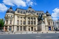 Bucharest, Romania, 6 May 2021: The Central University Library with equestrian monument to King Carol I in front of it in