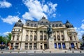 Bucharest, Romania, 6 May 2021: The Central University Library with equestrian monument to King Carol I in front of it in