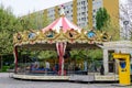 Bucharest, Romania - 1 May 2021: Colourful children colorful carousel with mixed plastic and metallic toys and materials in