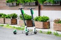 Bucharest, Romania, 24 May 2020 - Two Lime electric scooters parked on a sidework in front of a restaurant, alternative transport Royalty Free Stock Photo
