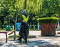 Bucharest/Romania - 06.03.2020:Municipal female worker sweeping the pavement with broomstick