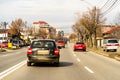 Many cars driving on a long road in Targoviste, Romania