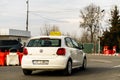 White Volkswagen taxi on a long road in Targoviste, Romania