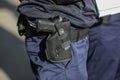 Details with a Beretta PX4 gun in the holster of a police officer