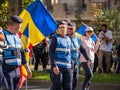 Female police officers and Gendarmerie or military police closely supervising the demonstrators