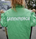 Greenpeace activist holding a banner at a protest Royalty Free Stock Photo