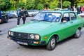 Bucharest, Romania, 24 October 2021: Old vivid green Romanian Dacia 1310 Sport classic car produced in year 1987 parked in a